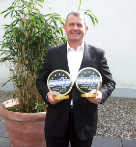 Graham Moore Director, Business Development, Ricoh Europe with the two EDP Awards